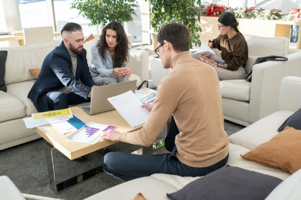 Young manager of modern company analyzing data in documents