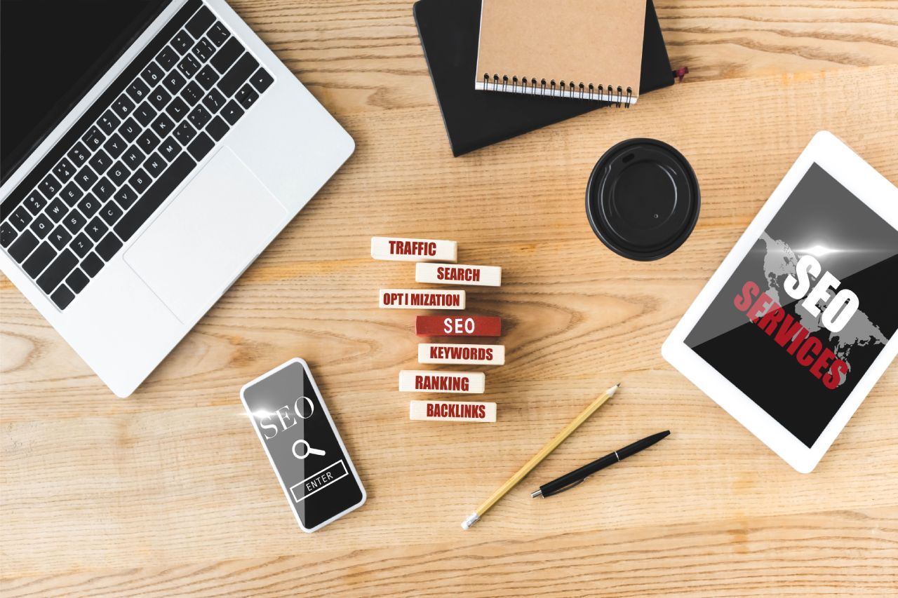 top view of wooden rectangles with illustration of concept words of seo, digital devices, notebooks, top view of wooden rectangles with illustration of concept words of seo, digital devices, notebooks,